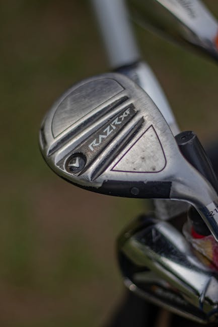 Detailed image of a silver golf club head showcasing its design.